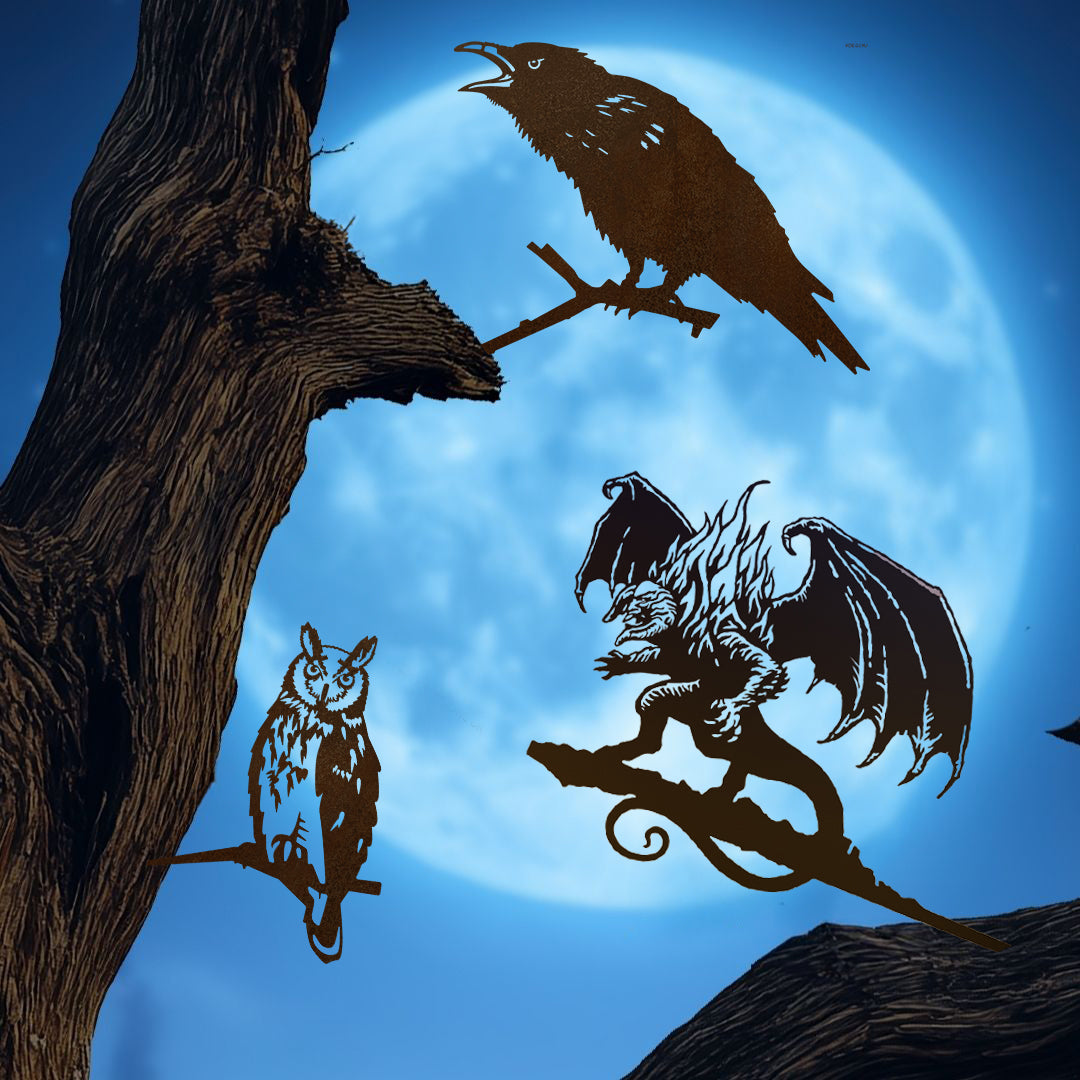 The Boo-tiful Bundle 🎃 by Metalbird UK features striking silhouettes of a raven, an owl, and a winged balrog on tree branches against a full moon—perfect Corten steel sculptures for your spooky Halloween yard or outdoor display.