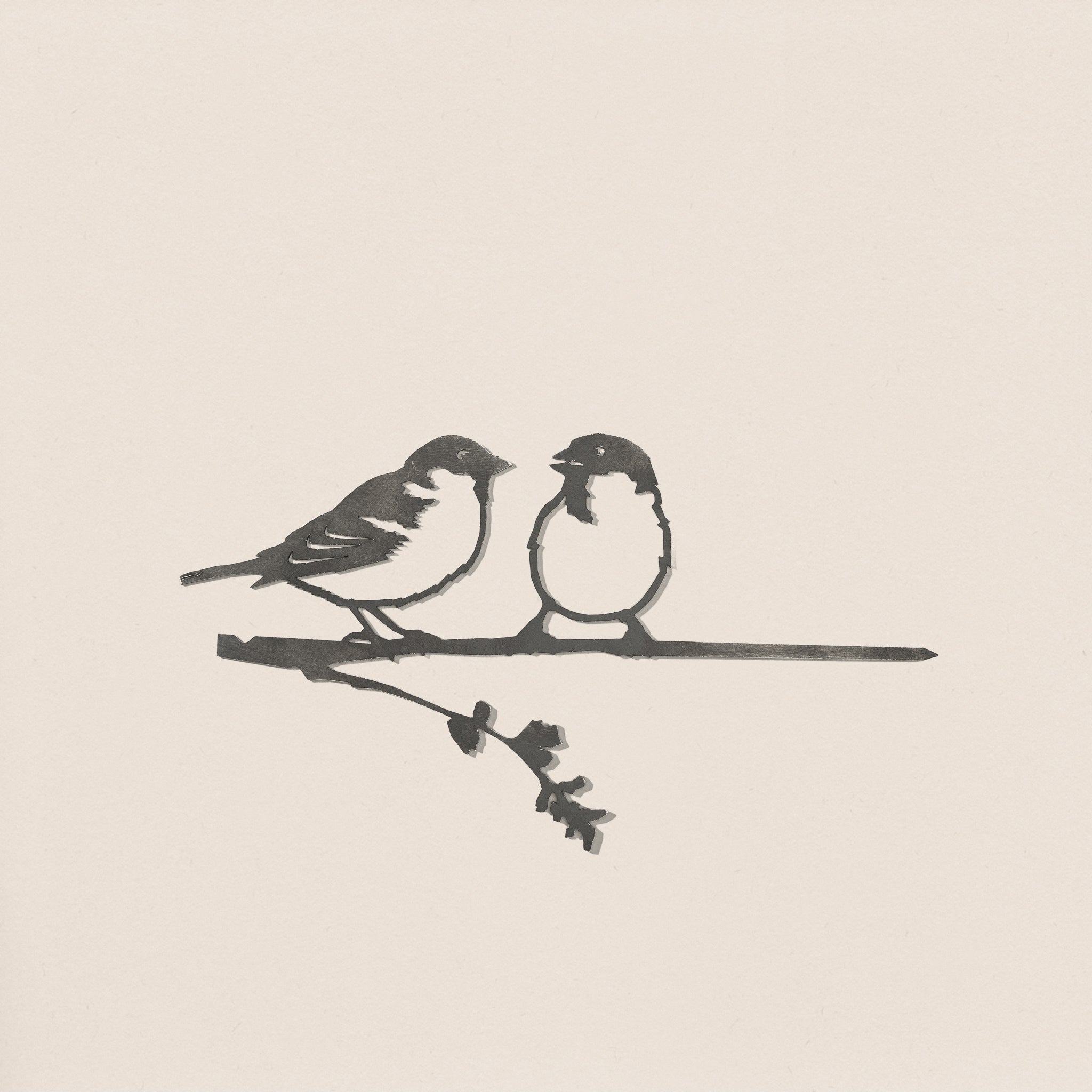 Pair of Sparrows" by Metalbird UK: A minimalist black and white illustration featuring two sparrows perched on a branch with leaves—ideal inspiration for metal yard art or corten steel decor.