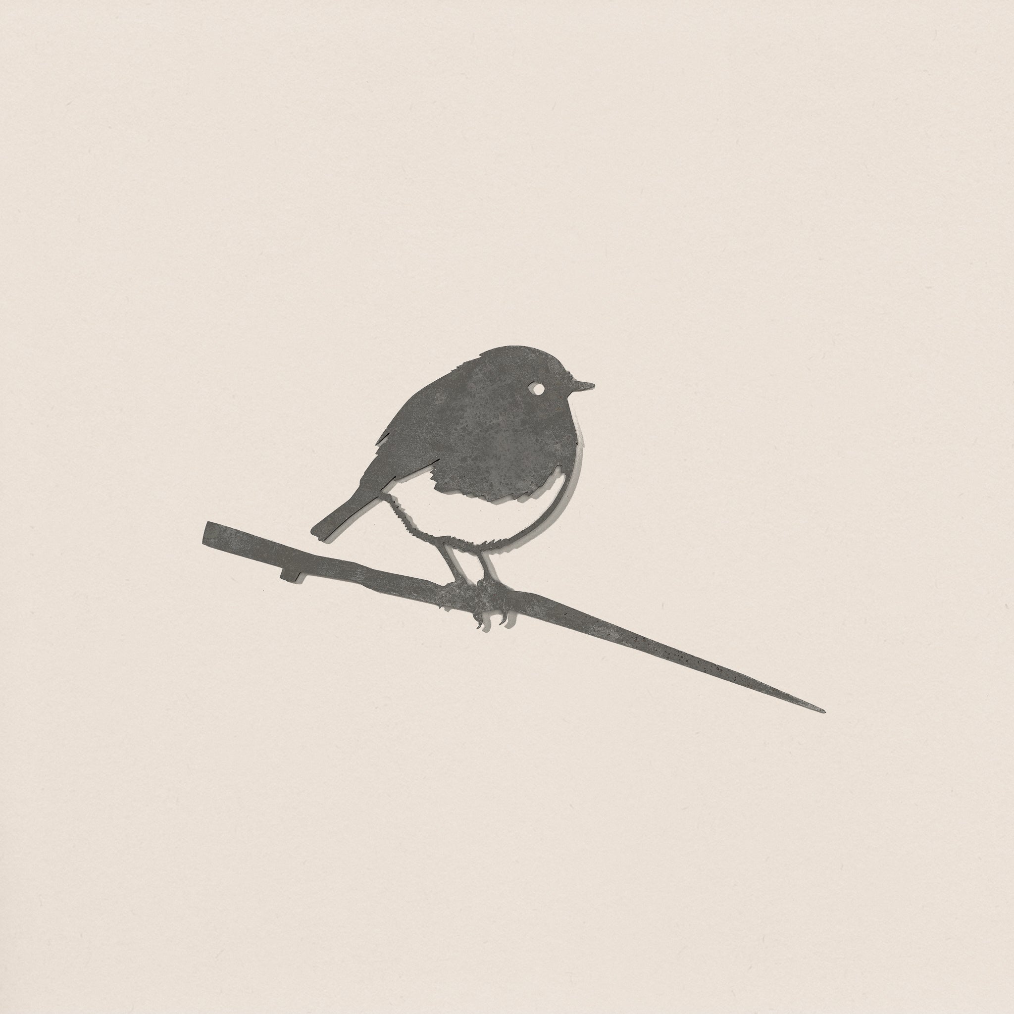 A minimalist monochrome silhouette of a robin perched on a thin branch by Metalbird UK, set against a plain light background. Soft-edged shapes make it ideal as modern yard art or a unique gift.