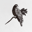 The Manumea - Seconds by Metalbird UK is a premium black corten steel parrot silhouette perched on a branch, mounted on a white textured wall.