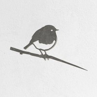 The Metalbird Seconds - Robin by Metalbird UK is a simple metal bird ornament featuring a robin perched on a branch, set against a plain white textured wall.