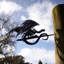 The FELL BEAST™ by Metalbird UK is a premium black metal dragon silhouette with outstretched wings, mounted on a wooden post—perfect for fantasy lovers and collectors.