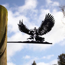 A striking yard art piece, the GANDALF™ ON GWAIHIR™ by Metalbird UK features a black metal silhouette perched on a branch atop a wooden post—an impressive gift for nature lovers.