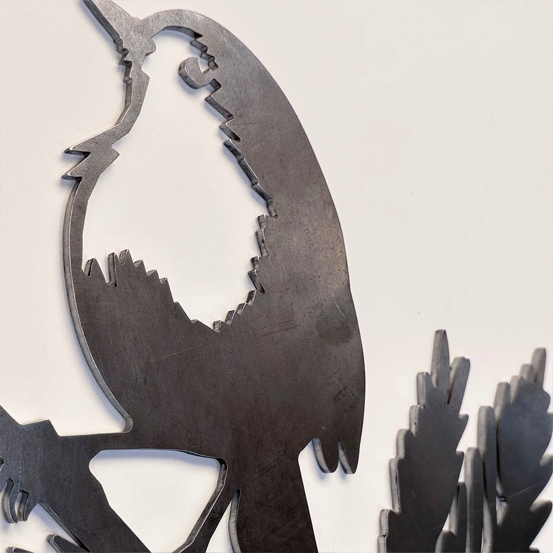 A close-up of the Metalbird UK Robin Redbreast ornament, crafted from Corten steel with detailed cutouts and smooth edges, set against a plain light background—a charming Valentine’s Day gift.