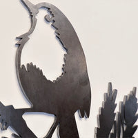 A close-up of the Metalbird UK Robin Redbreast ornament, crafted from Corten steel with detailed cutouts and smooth edges, set against a plain light background—a charming Valentine’s Day gift.