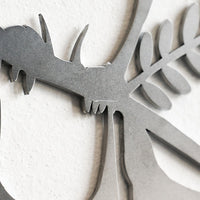 Close-up of Metalbird UK’s Metalbird Seconds - Robin Pair, a metallic wall art piece with stylized birds and detailed branch—ideal as discounted garden decor or for those seeking unique metal bird ornaments.
