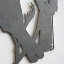 A close-up of Metalbird UK’s Metalbird Seconds - Robin Pair shows two stylized birds overlapping on a white background. Its matte gray cut-out design is perfect for adding flair to your discounted garden decor.