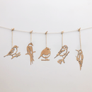 The Metalbird UK Wooden Hanging Decorations feature five bird-shaped silhouettes suspended by twine, creating charming yard art against any background.