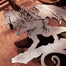 The BALROG™ by Metalbird UK features a corten steel dragon silhouette with detailed wings and a fierce expression, resting on a workbench—artisanally crafted and perfect as a unique gift.