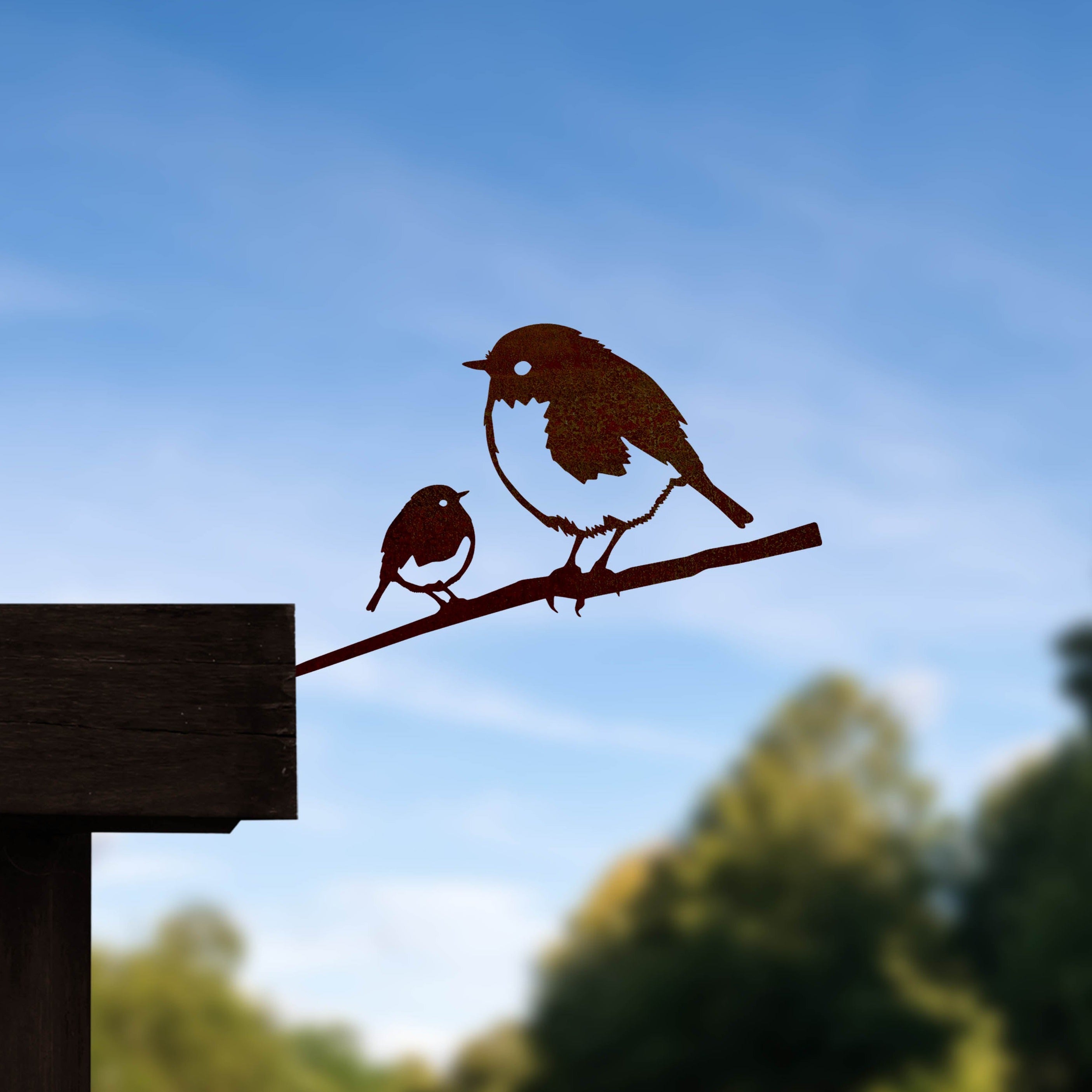 Metalbird UK’s Metalbird Seconds - Robin & Chick features a stylish metal silhouette of two birds on a branch, perfect as charming yard art for mounting on any wooden surface outdoors.