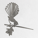 Metalbird Seconds - Fantail by Metalbird UK: A metal bird silhouette with a fanned tail and subtle flaws, perched on a leafy branch with a flower—ideal as discounted garden art for your outdoor space.