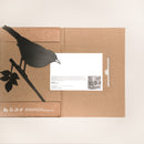 The Blackbird folder by Metalbird UK features a black bird silhouette holding a white card, with recycling and eco-friendly icons at the bottom—an ideal gift for those who care about the environment.