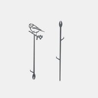 The Metalbird UK Pair Of Plant Stakes includes two black metal stakes: one with a bird and squirrel on a branch, the other with branching supports. Both have pointed ends for easy ground insertion and add charm to your garden.