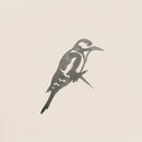 A minimalist, monochrome Great Spotted Woodpecker by Metalbird UK, shown perched in profile against a light background—ideal garden art or gift, inspired by the sleek lines of corten steel sculptures.