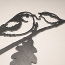 The Long-tailed Tit & Chick by Metalbird UK is a corten steel wall art featuring two birds on an oak branch in silhouette, set against a plain light background.