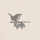 The Metalbird UK Wren is a metal silhouette of a small bird on a leafy branch, set against a light background. Its minimalist design highlights the bird and branch, making it a beautiful and thoughtful gift.