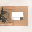 The Wren and Chicks folder by Metalbird UK features a black floral silhouette on brown card, with a slot holding a white card and grayscale photo—an ideal and unique gift presentation.