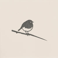 A minimalist monochrome silhouette of a robin perched on a thin branch by Metalbird UK, set against a plain light background. Soft-edged shapes make it ideal as modern yard art or a unique gift.