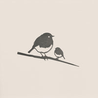 Robin and Chick by Metalbird UK features a minimalist silhouette of a large robin and its chick perched on a branch against a light background—ideal as a gift or delightful garden art.