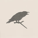 The "Raven" by Metalbird UK features a bold black silhouette of a crow with an open beak on a branch, set against a light beige background—ideal as unique garden art.