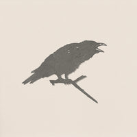 The "Raven" by Metalbird UK features a bold black silhouette of a crow with an open beak on a branch, set against a light beige background—ideal as unique garden art.