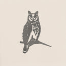 The Metalbird UK Long-eared Owl is a minimalist black corten steel silhouette of an owl perched on a branch, displayed against a plain off-white background.