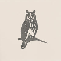 The Metalbird UK Long-eared Owl is a minimalist black corten steel silhouette of an owl perched on a branch, displayed against a plain off-white background.
