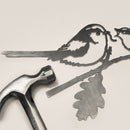 The Long-tailed Tit & Chick by Metalbird UK is a metal silhouette of two birds on branches, shown on a light surface with a silver hammer—perfect for adding charm to your garden art collection.