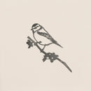 Minimalist ink illustration of a Blue Tit silhouette perched on a leafy branch by Metalbird UK, perfect as garden art or a thoughtful gift, set against a plain, light background.