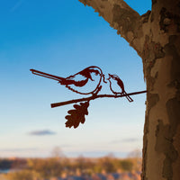 The Long-tailed Tit & Chick by Metalbird UK is a charming metal silhouette of two birds on a branch, designed for mounting on trees—a unique garden art piece and a perfect gift for nature lovers.